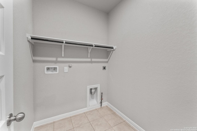 laundry room featuring hookup for a gas dryer, hookup for an electric dryer, washer hookup, and light tile patterned floors