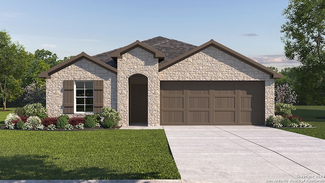 view of front of property with a garage and a front yard