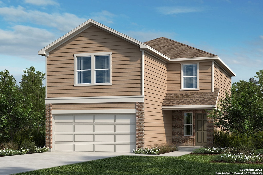 view of front of property with a garage and a front lawn