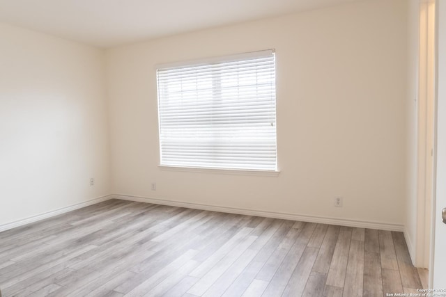 unfurnished room with light hardwood / wood-style flooring