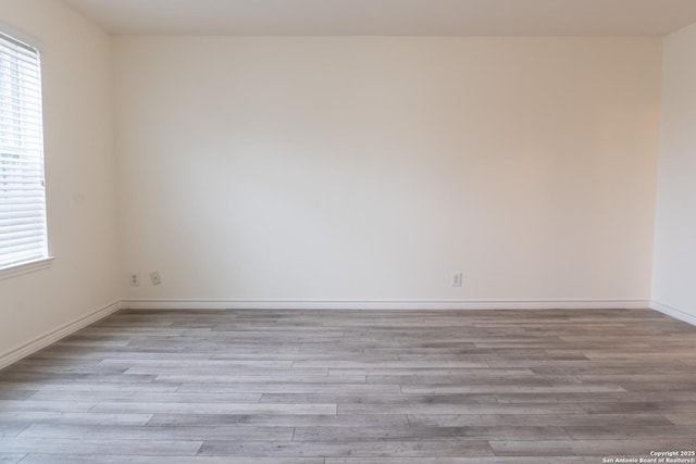 spare room with light hardwood / wood-style floors