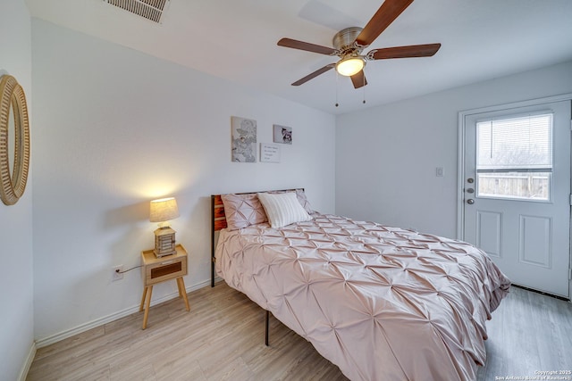 bedroom with ceiling fan and light wood-type flooring