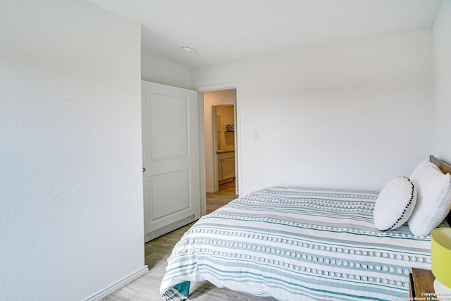 bedroom with light hardwood / wood-style flooring