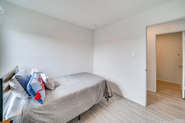 bedroom with light hardwood / wood-style flooring