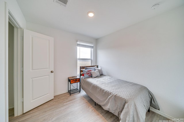 bedroom featuring light wood-type flooring