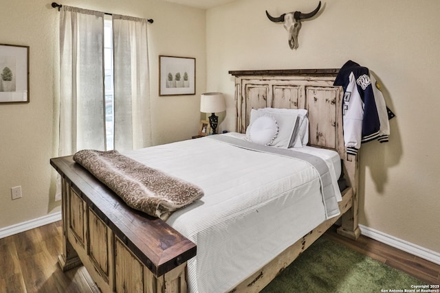 bedroom featuring dark wood-type flooring