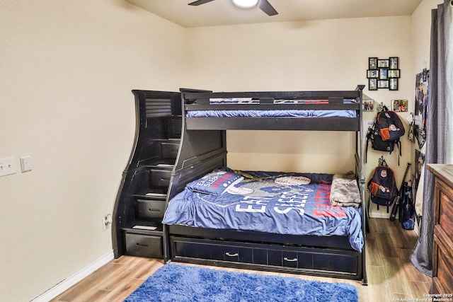 bedroom featuring hardwood / wood-style floors and ceiling fan