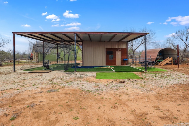 view of outdoor structure with a carport