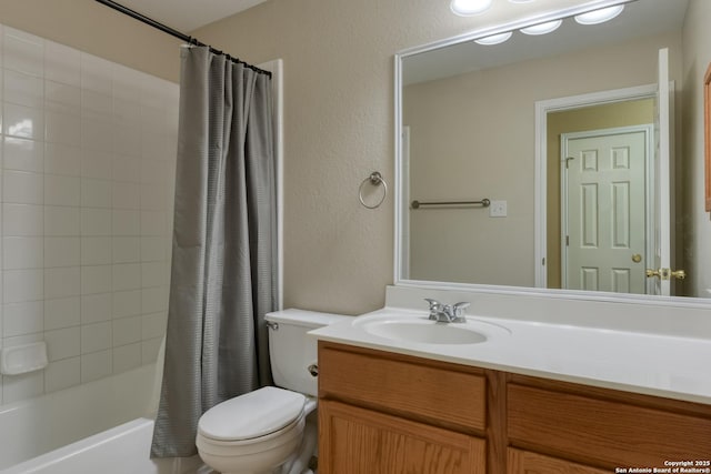 full bathroom featuring vanity, shower / tub combo with curtain, and toilet