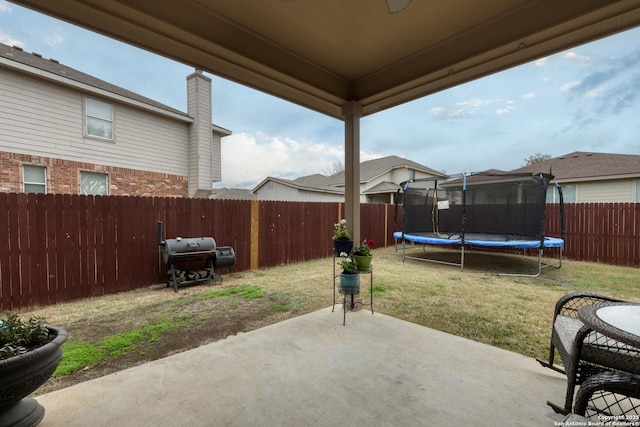 view of patio / terrace with a trampoline and area for grilling