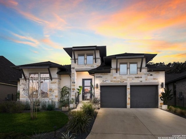 prairie-style house featuring a garage