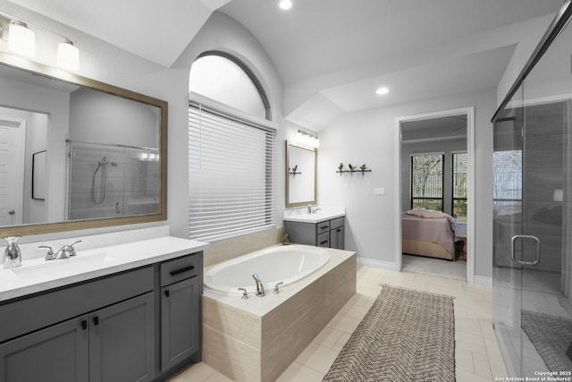 bathroom with vanity and independent shower and bath