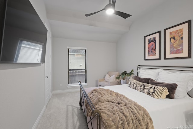 bedroom featuring vaulted ceiling, light colored carpet, and ceiling fan