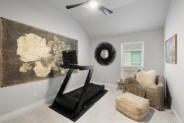 exercise room with vaulted ceiling, light colored carpet, and ceiling fan