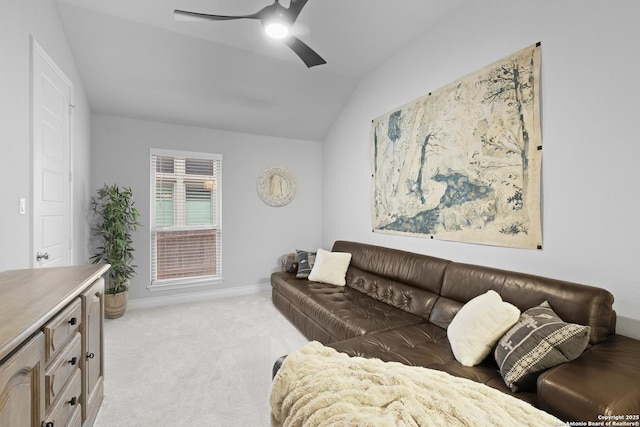 carpeted living room featuring vaulted ceiling and ceiling fan