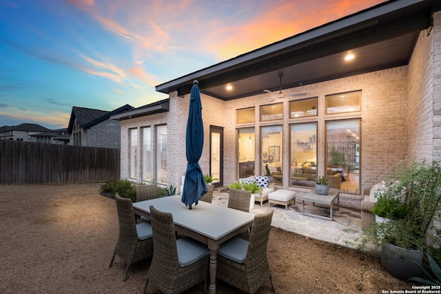 patio terrace at dusk with outdoor lounge area