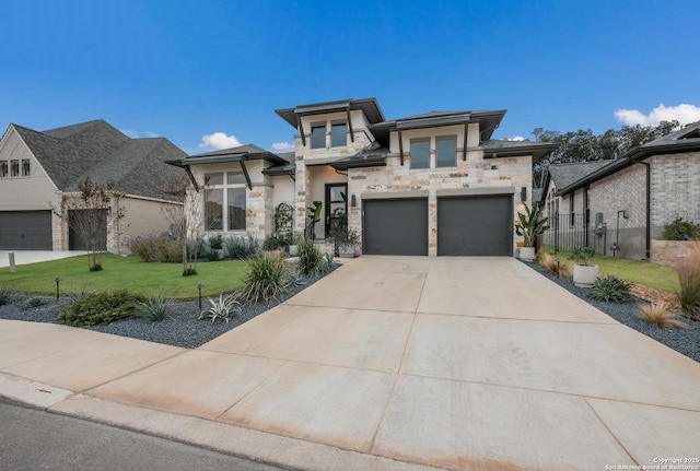 view of front of home featuring a garage and a front lawn