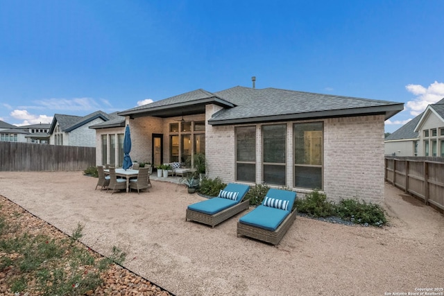 back of house with a patio