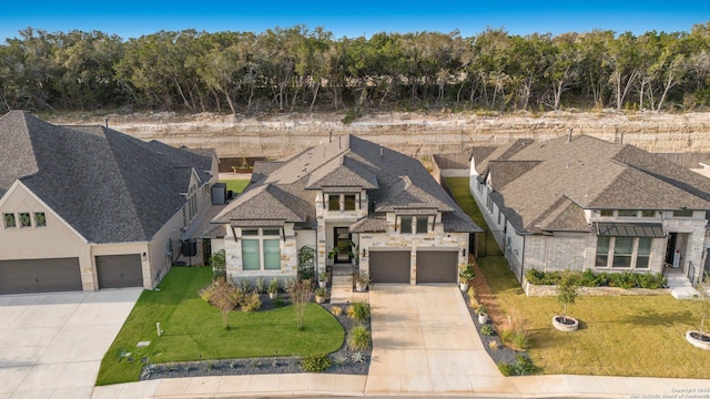 view of front facade featuring a garage and a front lawn