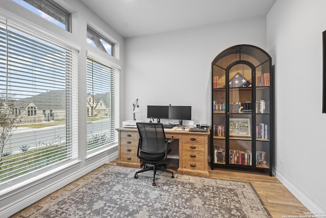 office area with hardwood / wood-style floors