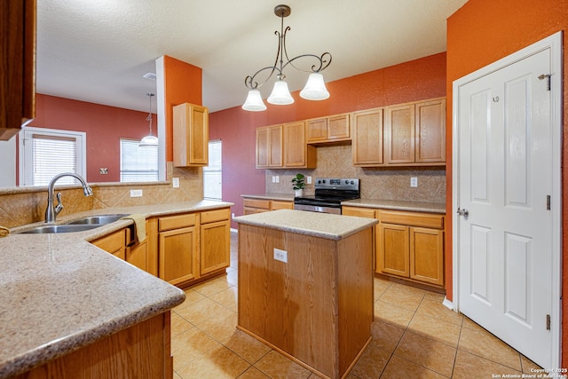 kitchen with a center island, pendant lighting, backsplash, a sink, and stainless steel range with electric stovetop