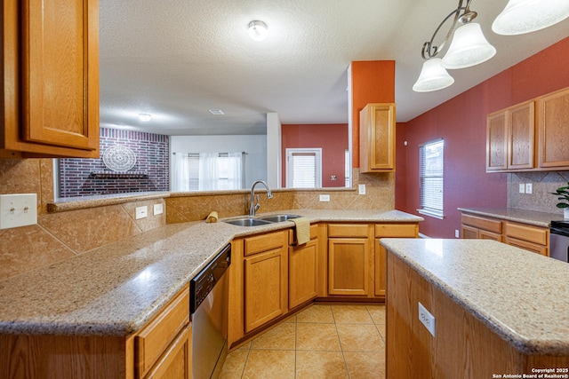 kitchen featuring dishwasher, a peninsula, a sink, and pendant lighting