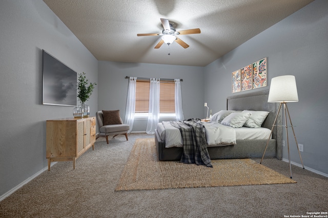 bedroom featuring carpet, a textured ceiling, and baseboards