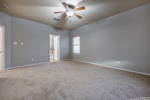 unfurnished room featuring light carpet, baseboards, visible vents, a ceiling fan, and a textured ceiling