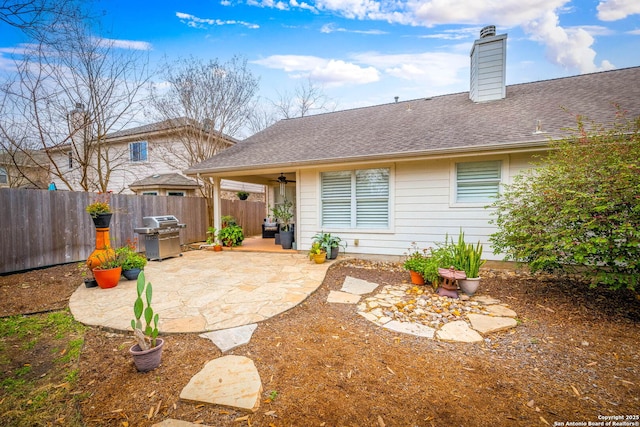 rear view of property featuring a patio area and ceiling fan