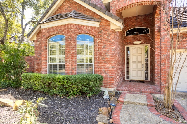 property entrance with brick siding