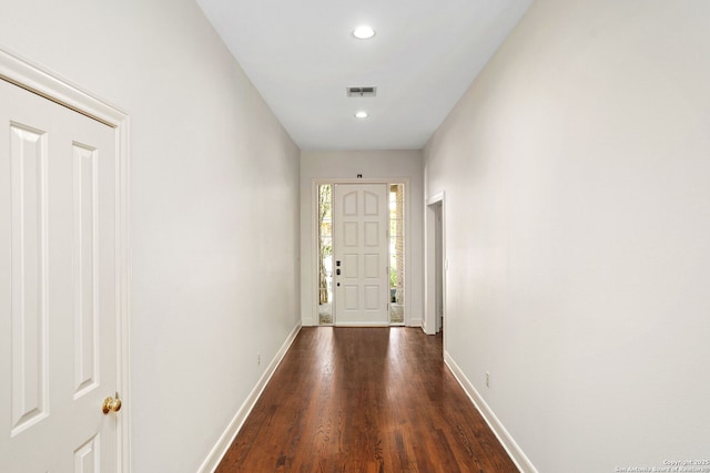 doorway to outside featuring recessed lighting, visible vents, baseboards, and wood finished floors