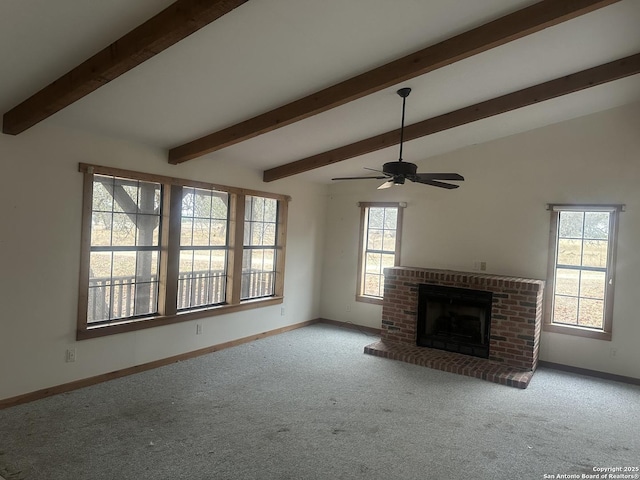 unfurnished living room featuring light carpet, a brick fireplace, vaulted ceiling with beams, and ceiling fan