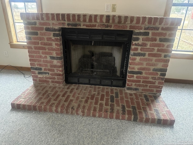 details featuring a brick fireplace