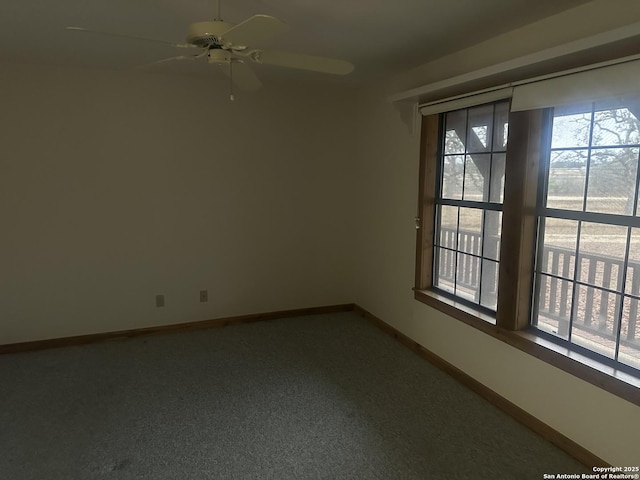 unfurnished room with ceiling fan and a wealth of natural light