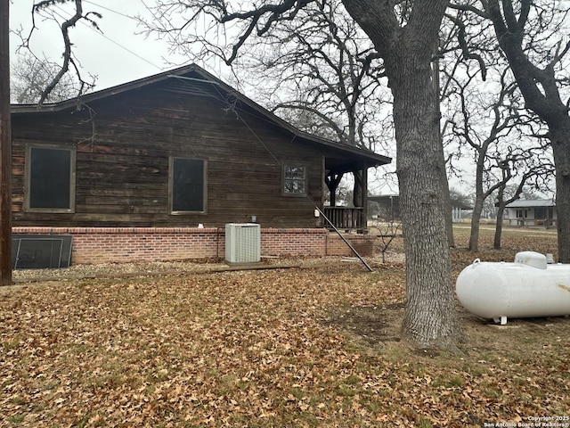 view of side of property with central air condition unit