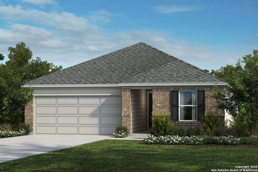 view of front of home with a garage and a front yard