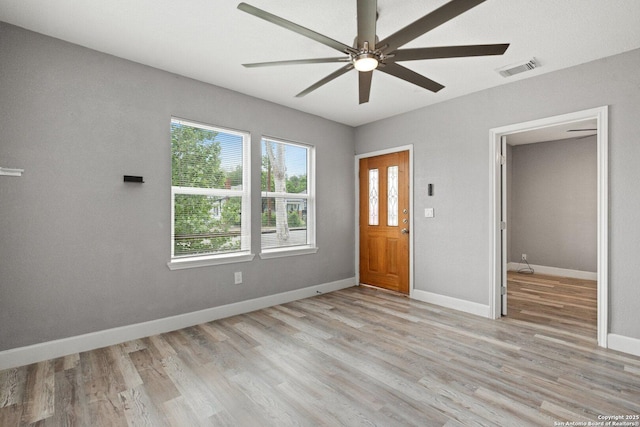 entrance foyer featuring light wood-type flooring, baseboards, visible vents, and ceiling fan