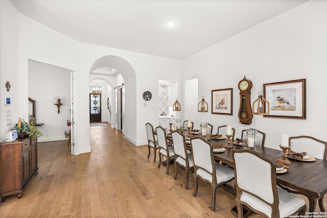 dining area with light hardwood / wood-style flooring