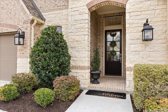 doorway to property featuring a garage