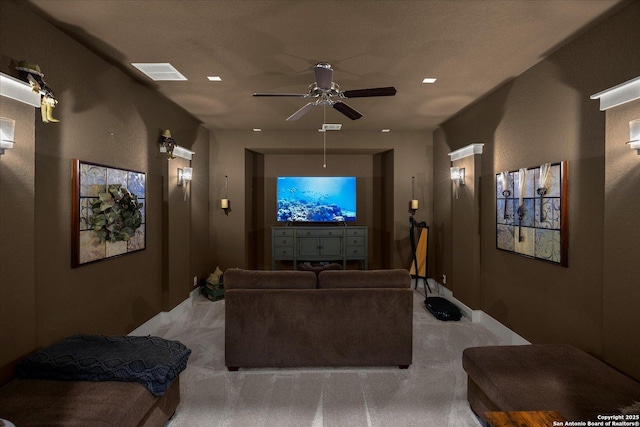 home theater room with light colored carpet