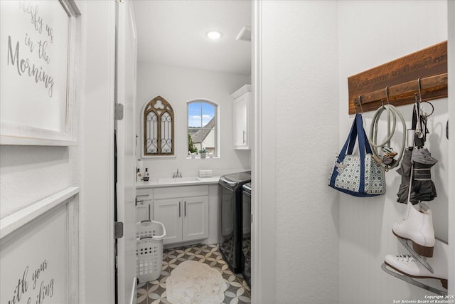 bathroom with vanity and washing machine and dryer