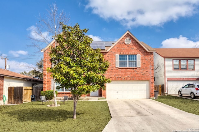 view of front of home featuring a garage, a front yard, and solar panels