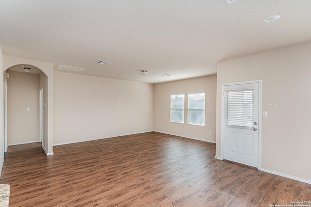 empty room featuring dark hardwood / wood-style floors