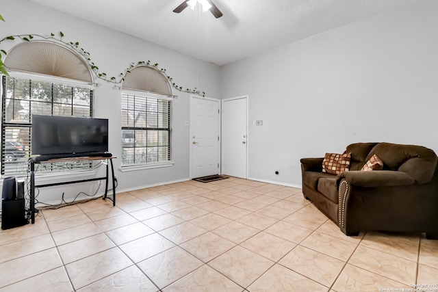 interior space with ceiling fan