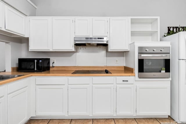 kitchen featuring white cabinetry, sink, and black appliances