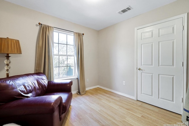 sitting room featuring light hardwood / wood-style floors