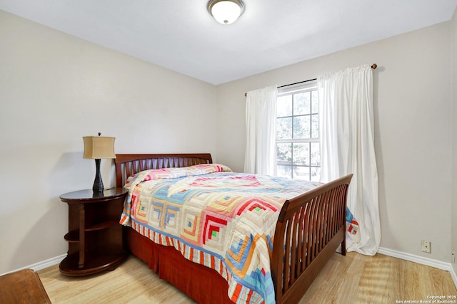 bedroom with light hardwood / wood-style floors