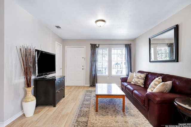 living room with light hardwood / wood-style flooring