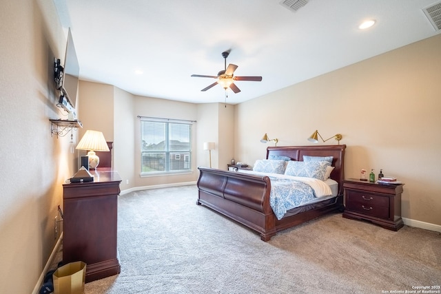 bedroom with ceiling fan and light colored carpet