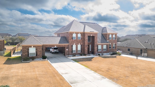 view of front of property featuring a garage and a front yard